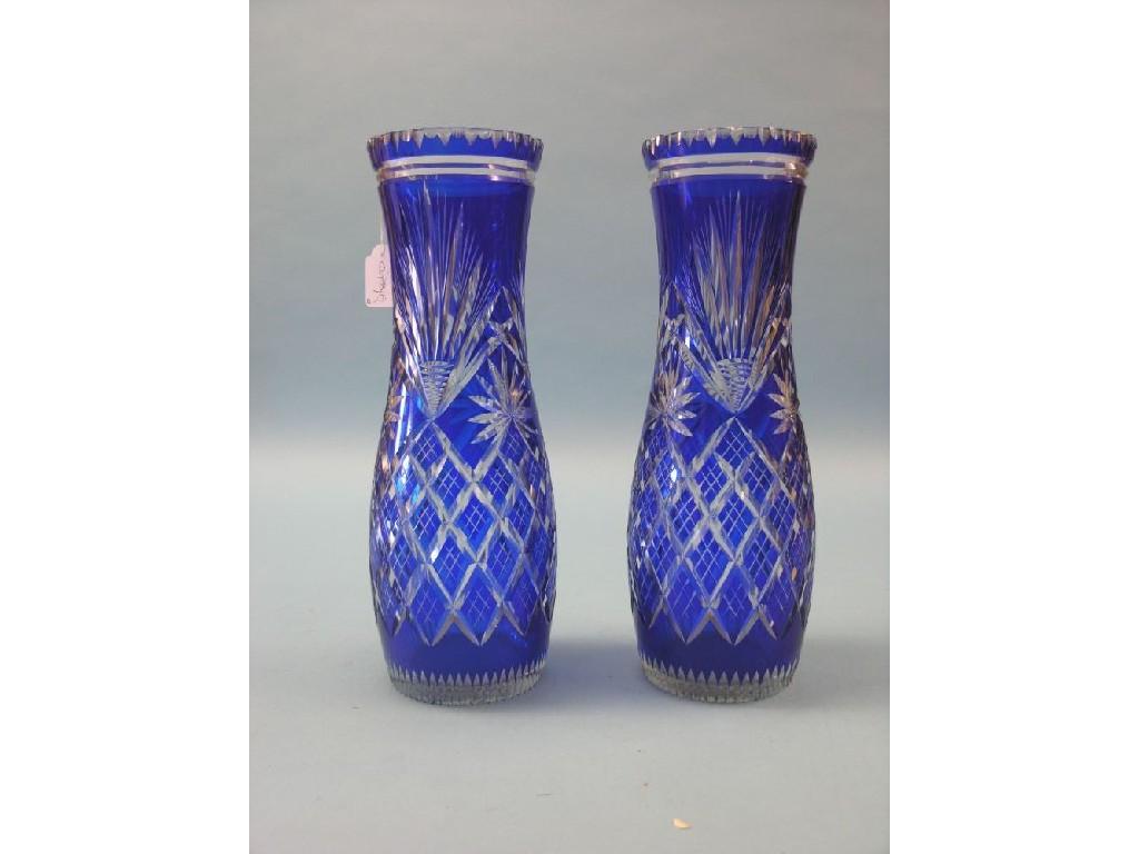 Appraisal: A pair of large blue-overlaid glass vases baluster-shape with cut