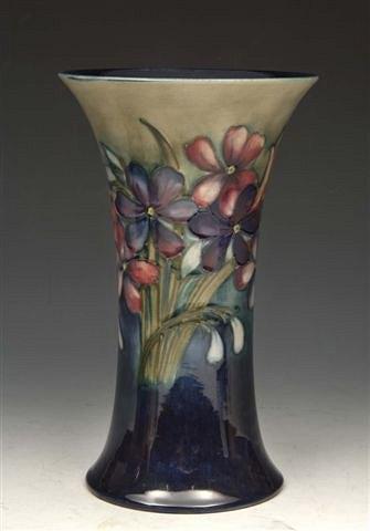 Appraisal: A MOORCROFT 'ORCHID AND SPRING FLOWER' TRUMPET SHAPED VASE probably