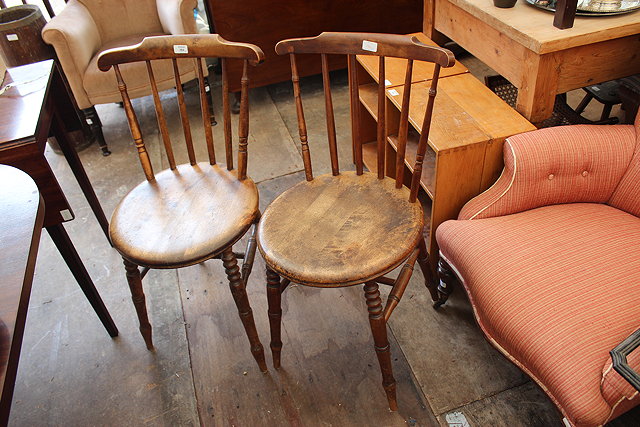 Appraisal: A PAIR OF ELM SEATED SPINDLE BACK KITCHEN CHAIRS circular