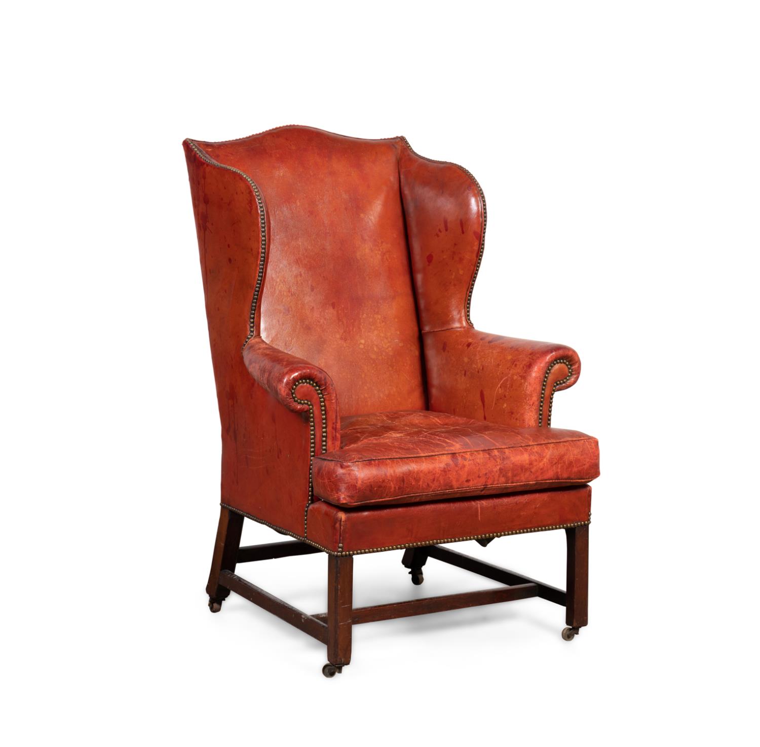 Appraisal: GEORGIAN STYLE BROWN LEATHER WINGBACK ON CASTERS English brown leather