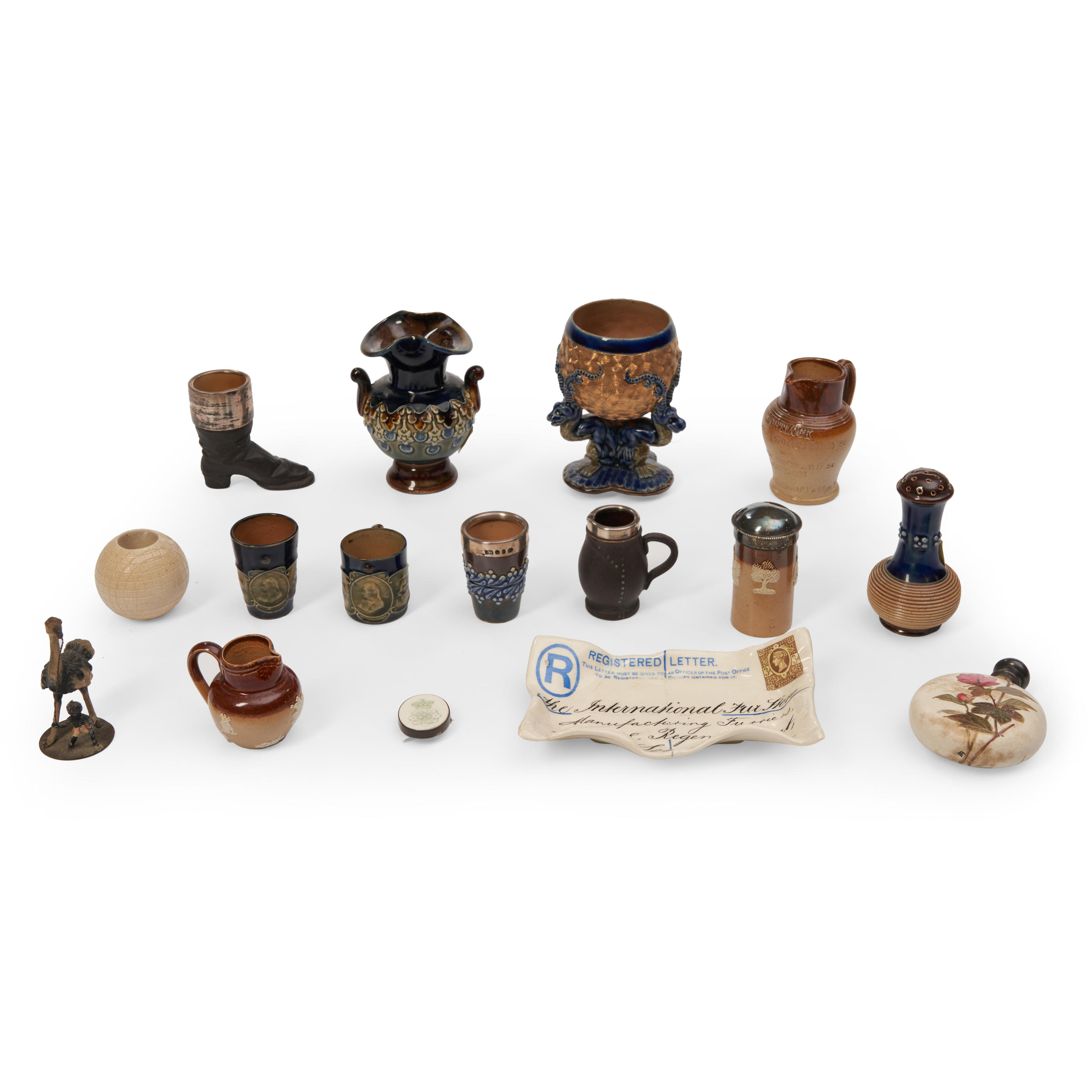 Appraisal: FIFTEEN MINIATURE DOULTON ITEMS including a gilt dragon-form tripod footed