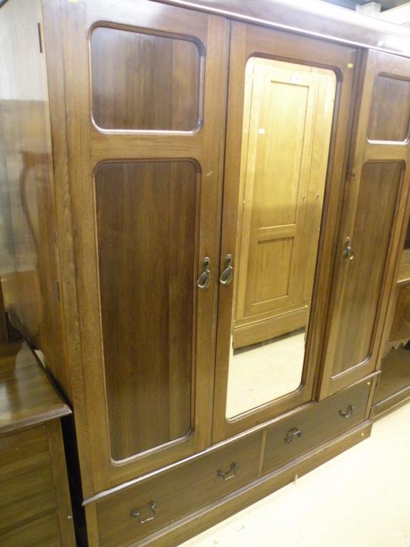 Appraisal: An Edwardian mahogany wardrobe with two panelled doors a central