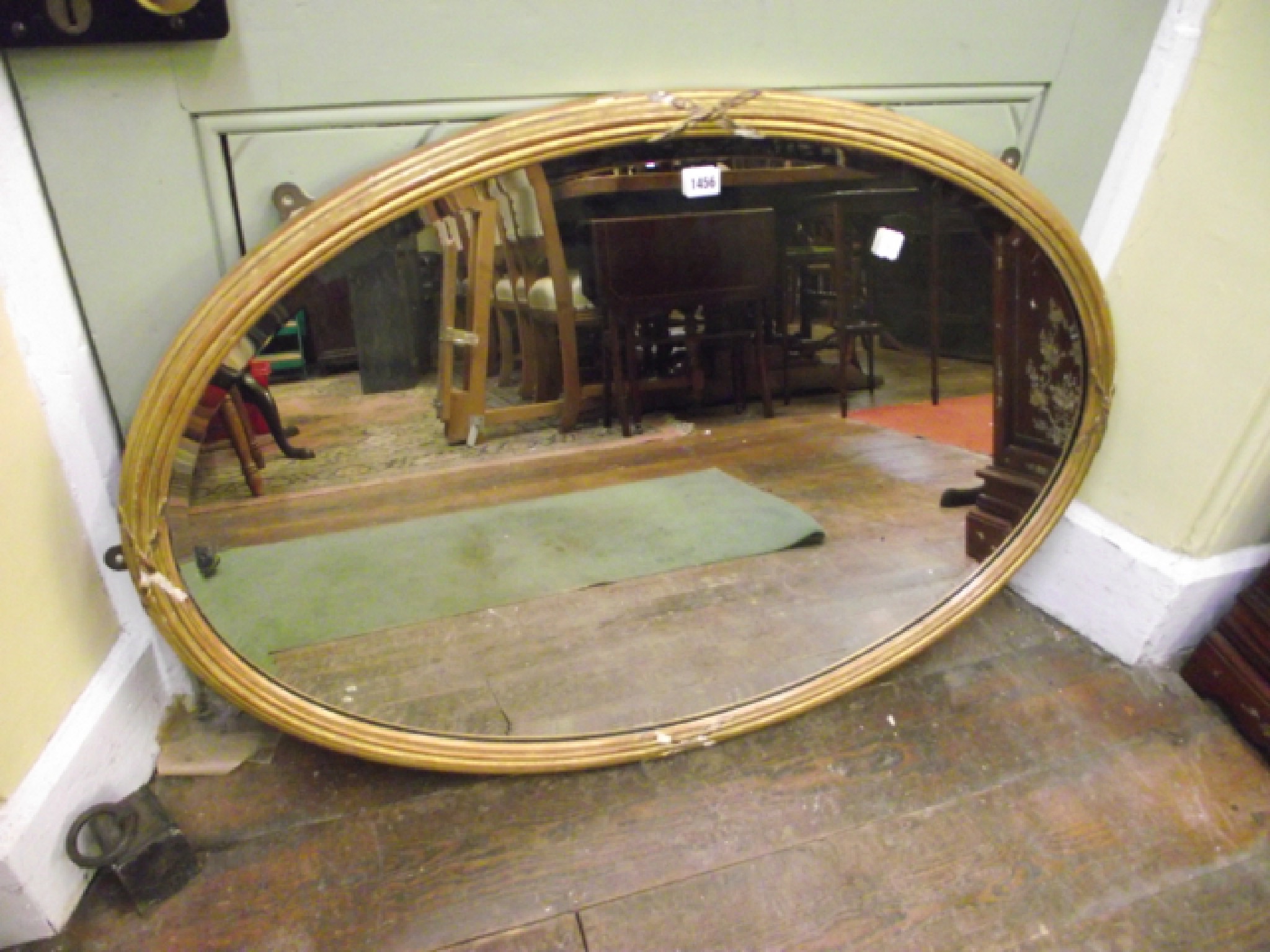 Appraisal: A th century mirror of oval form in a reeded