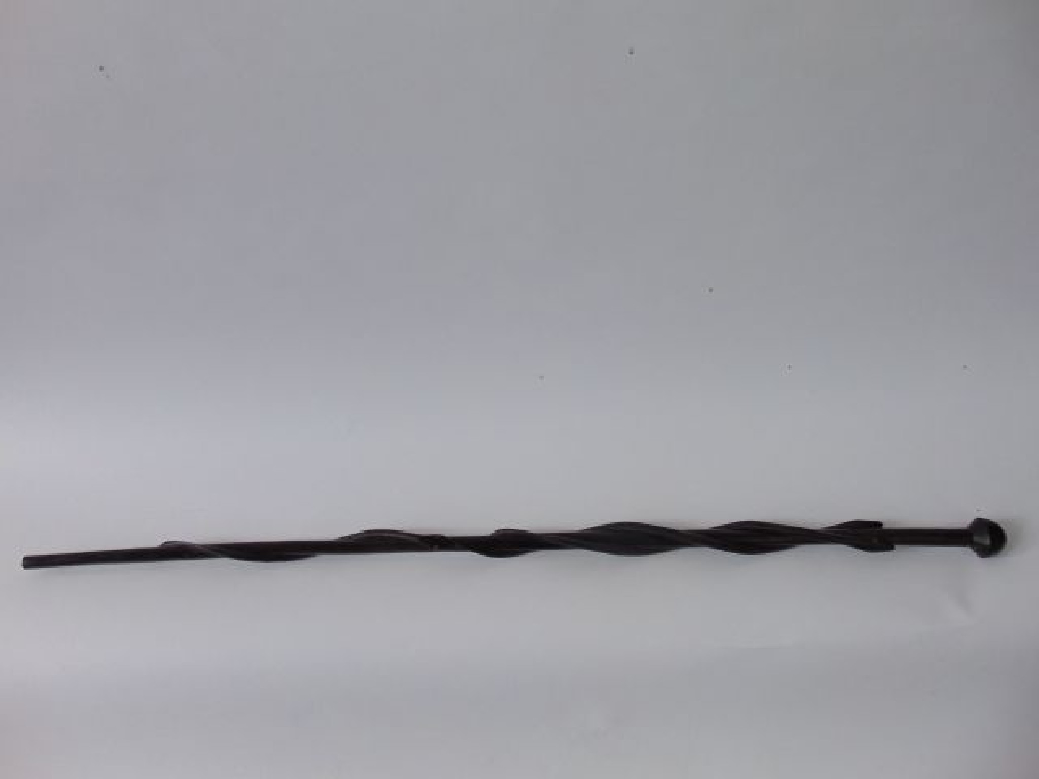 Appraisal: A carved hardwood cane decorated with three coiling snakes with