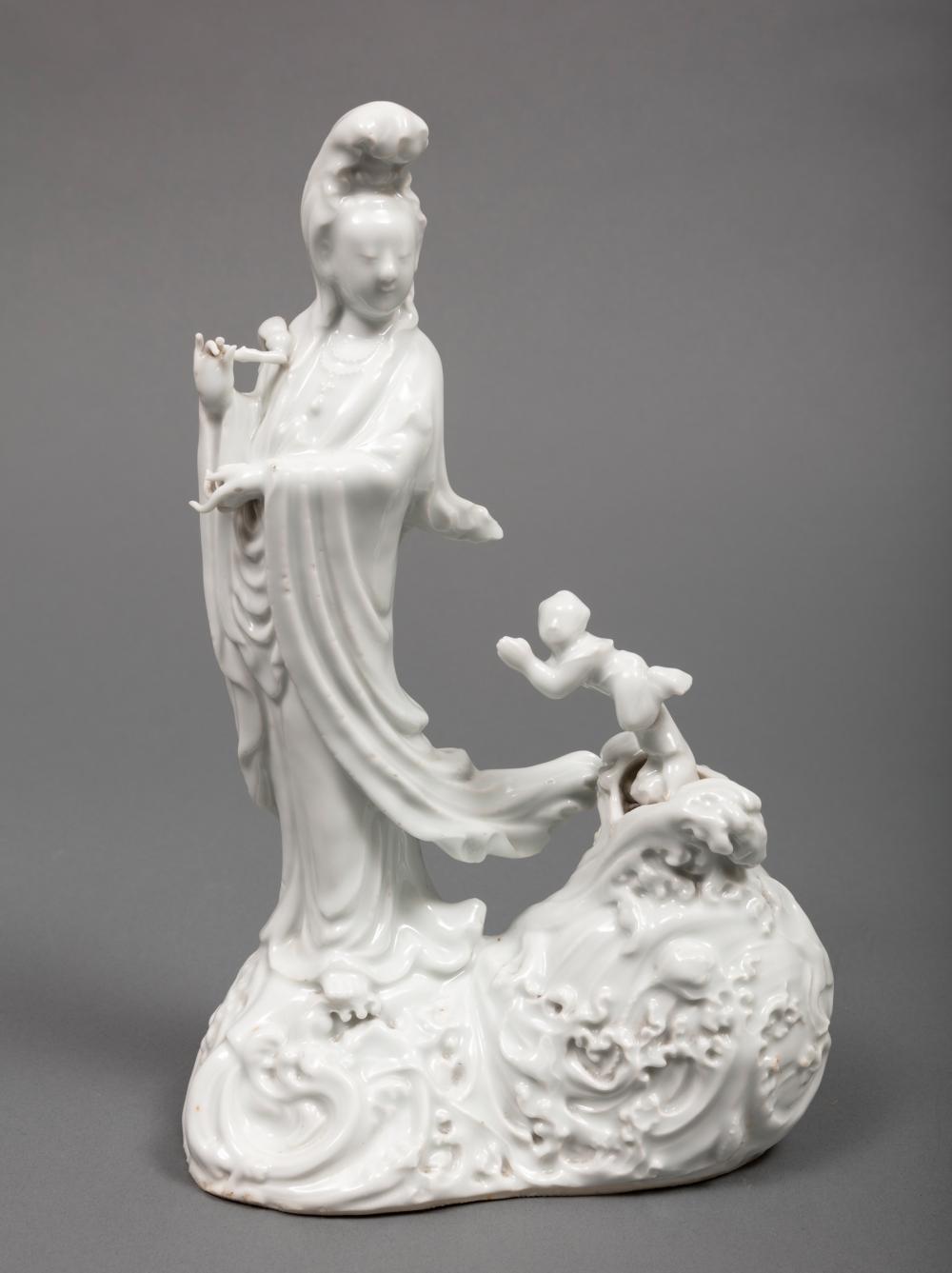 Appraisal: Chinese White Glazed Figural Group modeled as Guanyin standing on