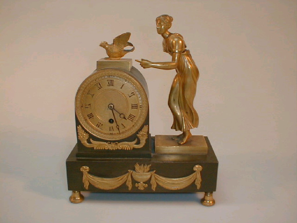 Appraisal: A thC French bronze and ormolu table clock with female