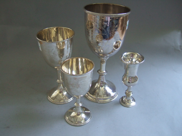 Appraisal: A silver trophy cup presentation inscribed within a foliate cartouche