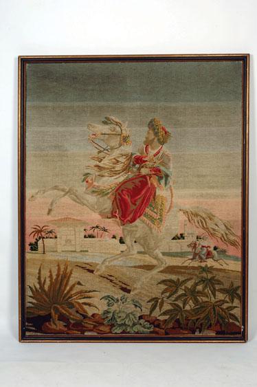 Appraisal: A LARGE WOOLWORK PICTURE of a man on horseback in