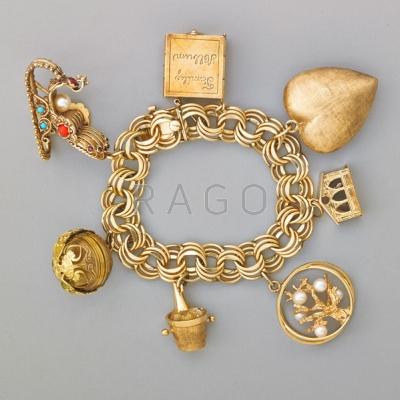 Appraisal: K GOLD CHARM BRACELET Triple-link bracelet suspends seven large k