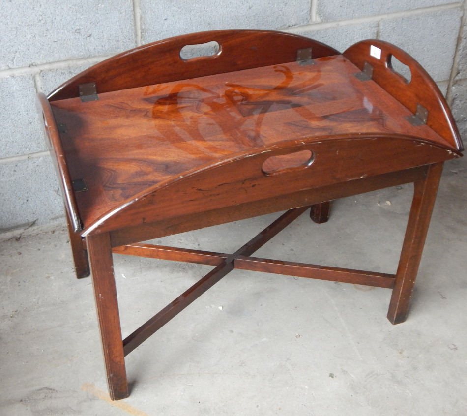 Appraisal: A thC mahogany butler's tray on stand the articulated top