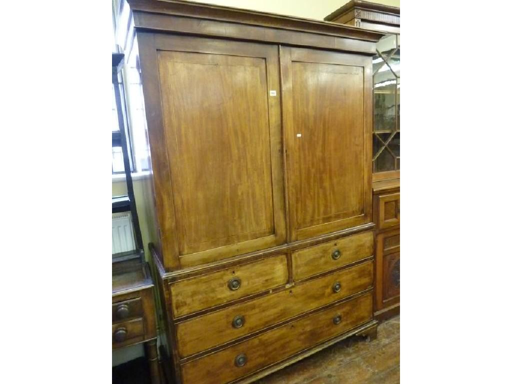 Appraisal: A Georgian mahogany linen press with moulded cornice over a