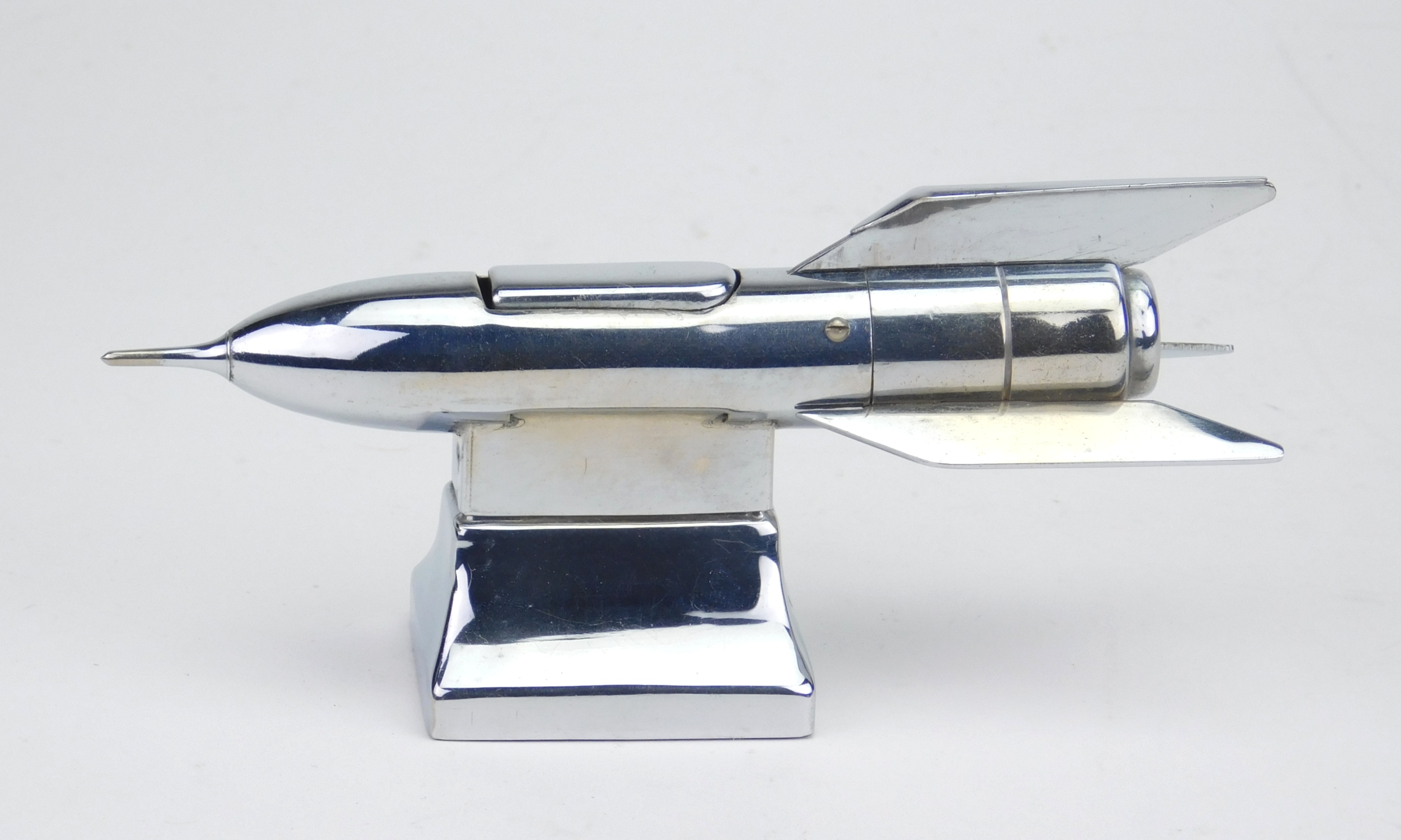 Appraisal: Vintage Occupied Japan chrome rocket ship lighter ca - on