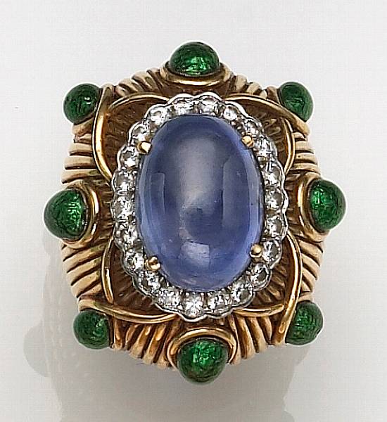 Appraisal: the gold ring centering an oval-shaped sapphire cabochon encircled by