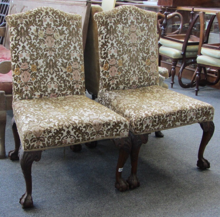 Appraisal: A pair of George I style humpback side chairs on