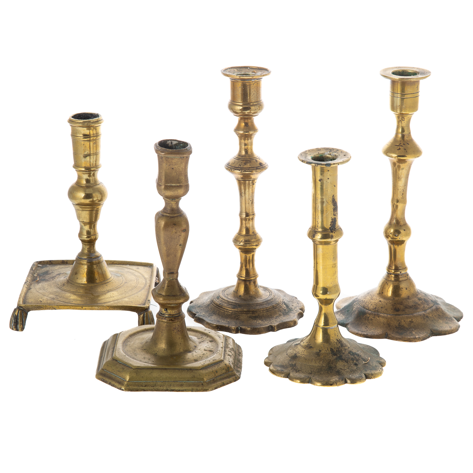 Appraisal: FIVE ENGLISH CONTINENTAL BRASS CANDLESTICKS Second half th century includes