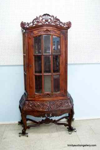 Appraisal: Carved Walnut Beveled Glass Curio CabinetBeautifully detailed carved hardwood with