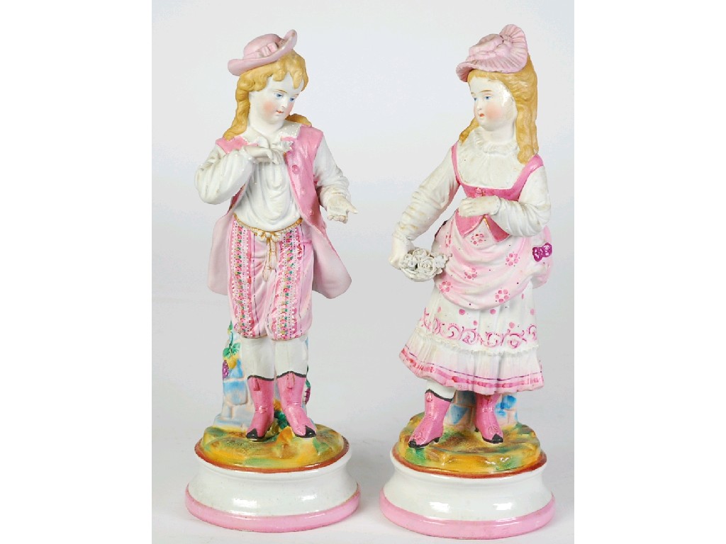 Appraisal: PAIR OF CONTINENTAL TINTED BISQUE FIGURES predominantly painted in pink