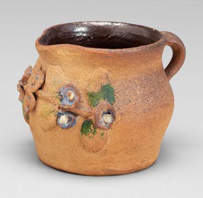 Appraisal: Brown Pottery pitcher applied flowers and leaves with painted decoration