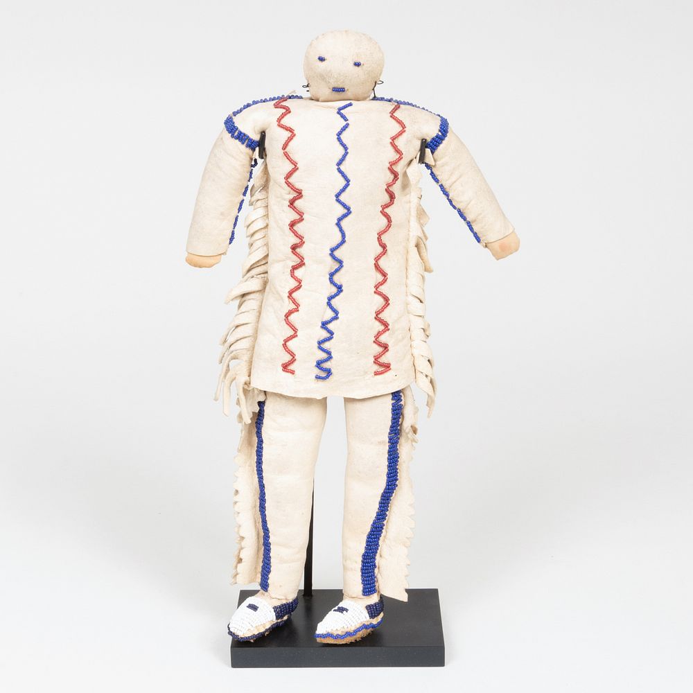 Appraisal: Plains Beaded and Hide Doll Raised on a stand with