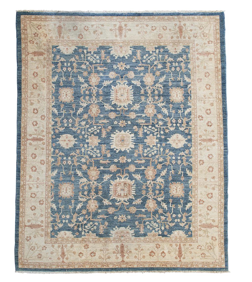 Appraisal: ZEIGLER STYLE CARPET MODERN the abrash blue field with stylised