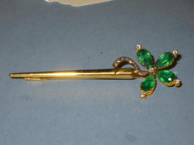 Appraisal: A GREEN STONE AND DIAMOND BROOCH comprising four pear cut