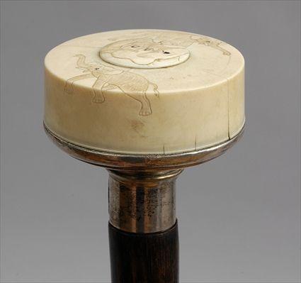 Appraisal: STAINED WOOD WALKING STICK WITH SILVER-MOUNTED JAPANESE CARVED IVORY HANDLE