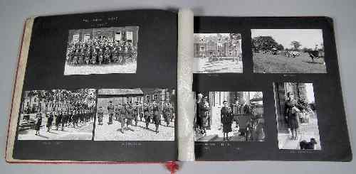 Appraisal: A s red leatherette covered photograph album containing black and