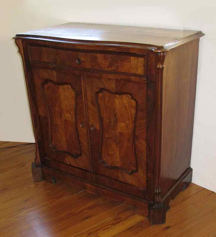 Appraisal: FRENCH WALNUT COMMODE Serpentine overhanging top full length drawer over