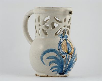 Appraisal: A tin-glazed puzzle jug painted with a large tulip in