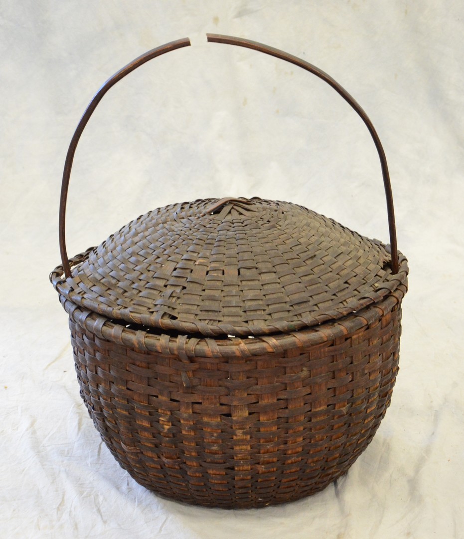 Appraisal: High Handled Dark Covered Basket diameter x h several breaks