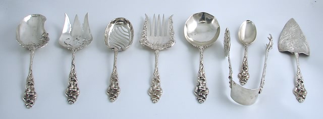 Appraisal: Heavily chased floral handles consisting of Reed Barton dessert spoon