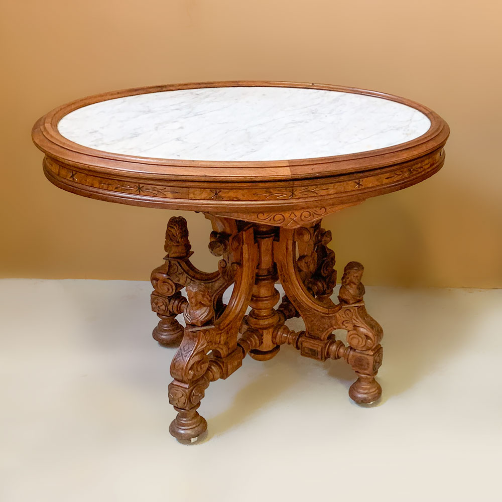 Appraisal: VICTORIAN MARBLE TOP TABLE WITH FIGURAL BASE Oval Victorian marble