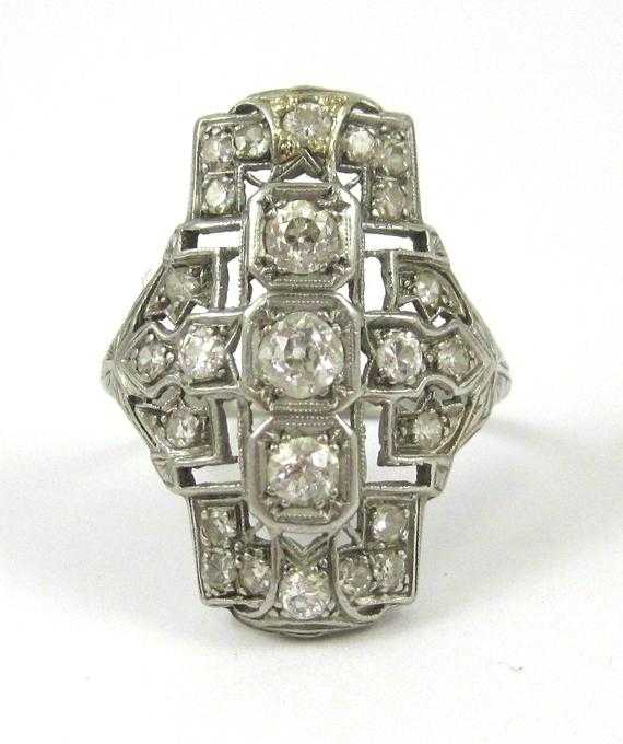 Appraisal: ART DECO DIAMOND AND PLATINUM RING The filigree platinum setting