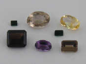 Appraisal: A quantity of loose polished gemstones including an oval citrine