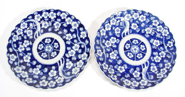 Appraisal: Pair of Chinese fluted porcelain chargers hand painted with blue