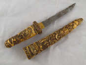 Appraisal: A large Oriental dagger with well carved ivory grip and