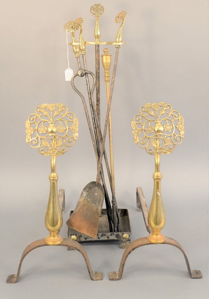 Appraisal: Brass and iron andirons and tools art nouveau flower style