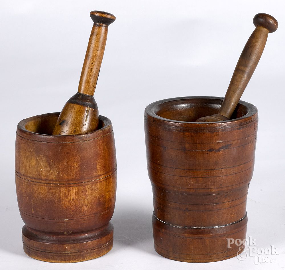 Appraisal: Two turned mortar and pestles th th c Two turned