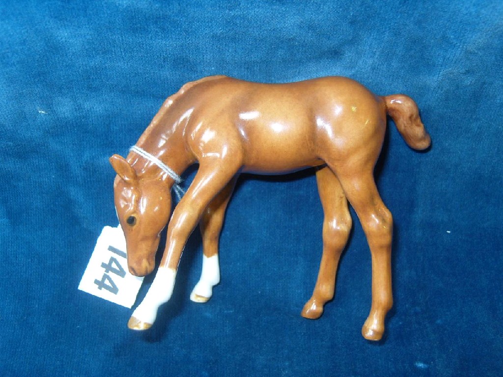 Appraisal: A Beswick foal grazing