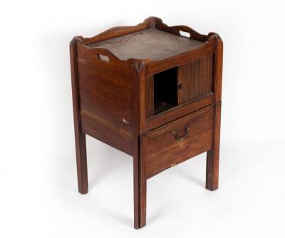 Appraisal: A late th Century mahogany tray-top bedside cupboard with a