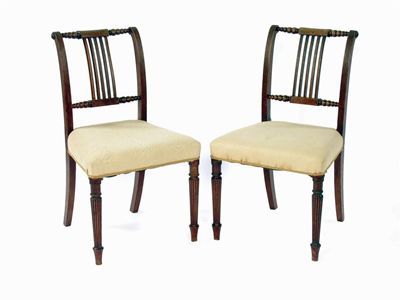 Appraisal: A pair of early th century mahogany sidechairs the turned