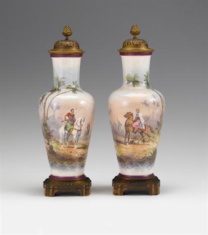 Appraisal: Pair of Sevres style gilt bronze mounted porcelain covered urns