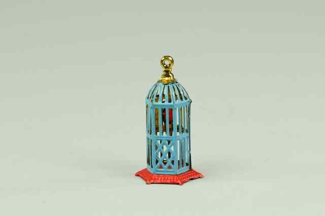 Appraisal: BIRDCAGE PENNY TOY Brightly lithographed parrot inside Meier cage produced