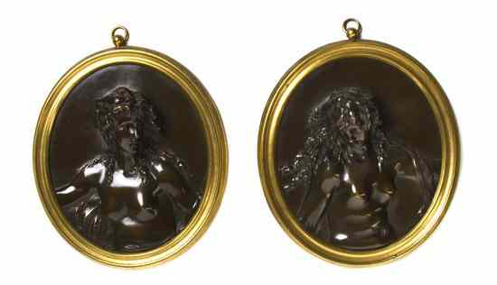 Appraisal: Two Continental Gilt and Patinated Bronze Relief Medallions after Clodion