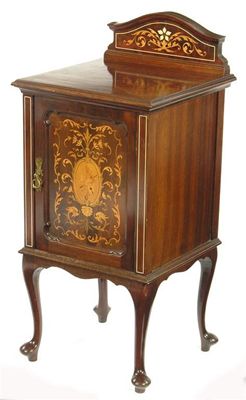 Appraisal: An Edwardian mahogany and marquetry bedside cupboard the hinged door