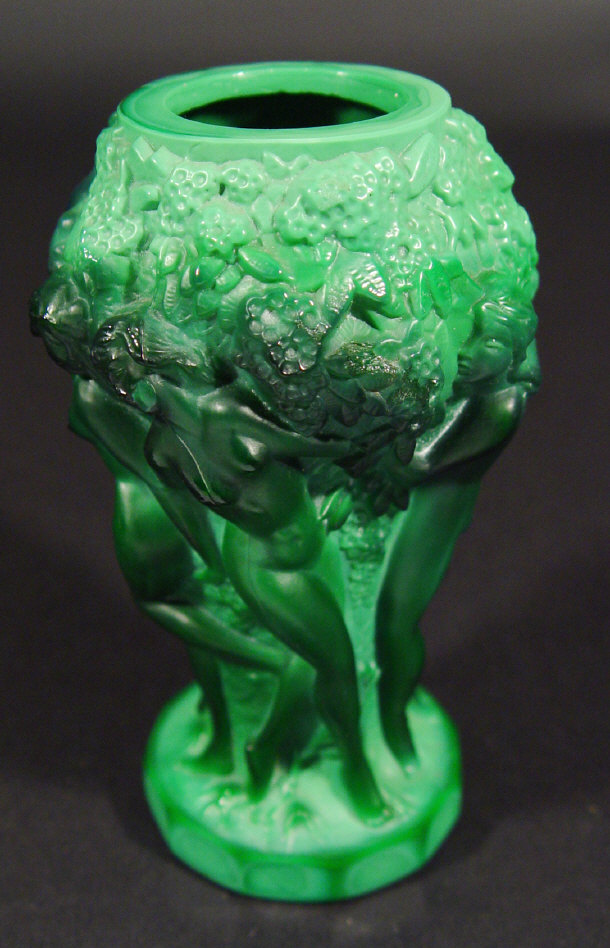 Appraisal: Czechoslovakian green glass vase moulded with a continuous band of