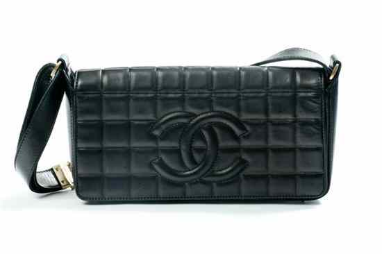 Appraisal: CHANEL BLACK QUILTED LEATHER HANDBAG Contemporary Rectangular the cover with