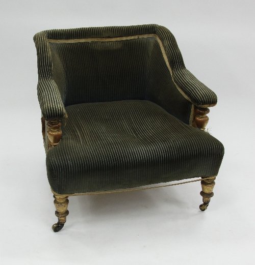 Appraisal: A Victorian upholstered armchair on gilded turned legs