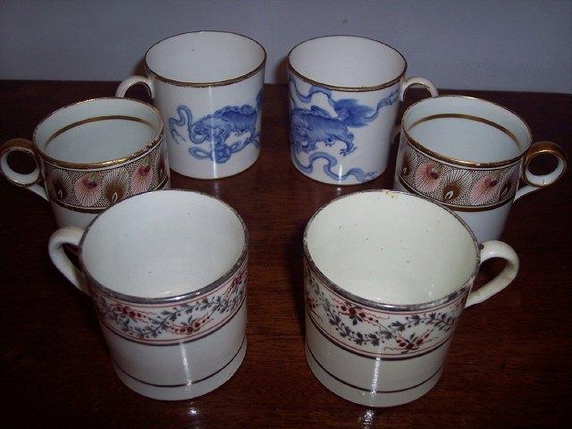 Appraisal: A pair Wedgwood blue and white coffee cans decorated dogs