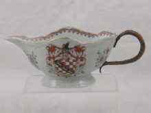 Appraisal: A cane handled Chinese armorial sauceboat circa bearing the full